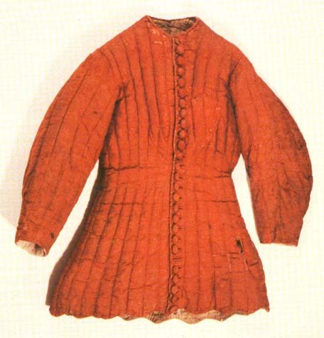 Arming Cote of Charles VI. originate from c. 1400. It is made from red silk damask, padded by wool, from 14th Century Garments; Forest.